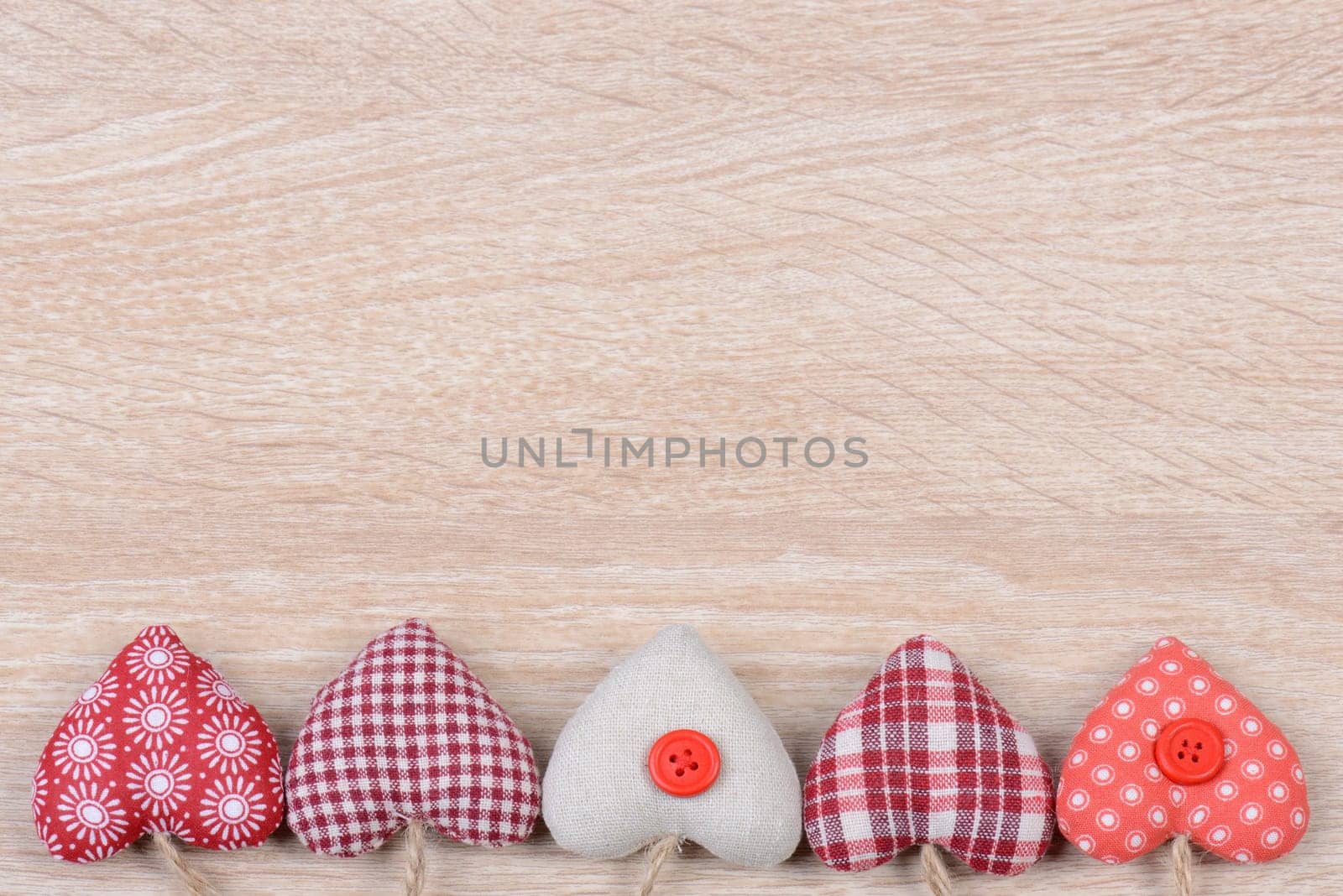 Hearts on wood background