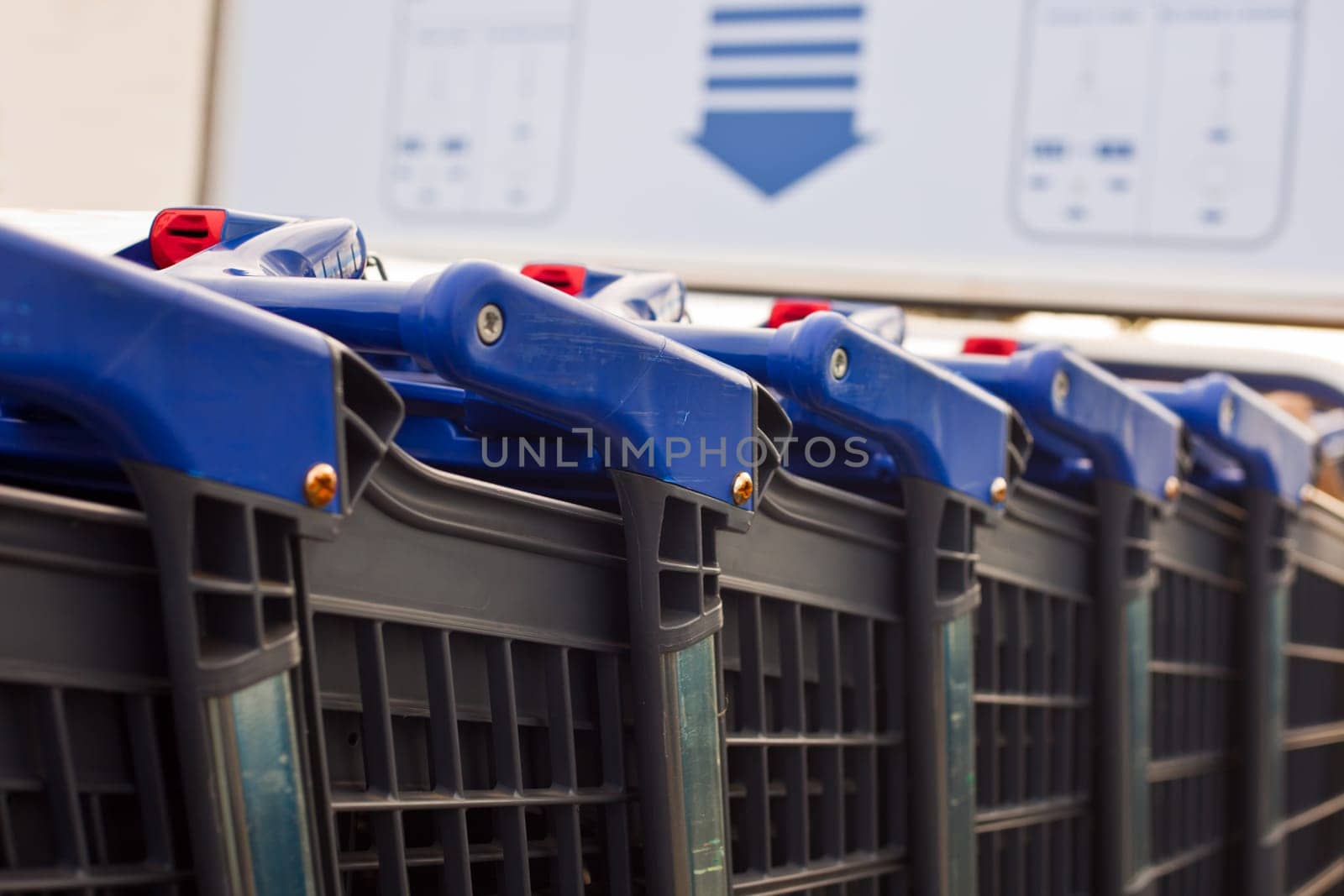 Blue shopping carts on a parking lot outdoors the mall