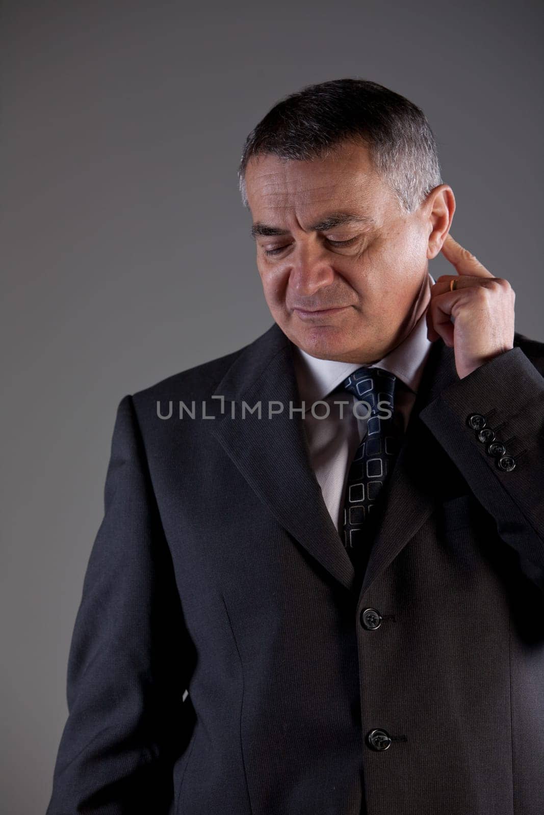 an old man doubtful maybe thinking about a problem or the future