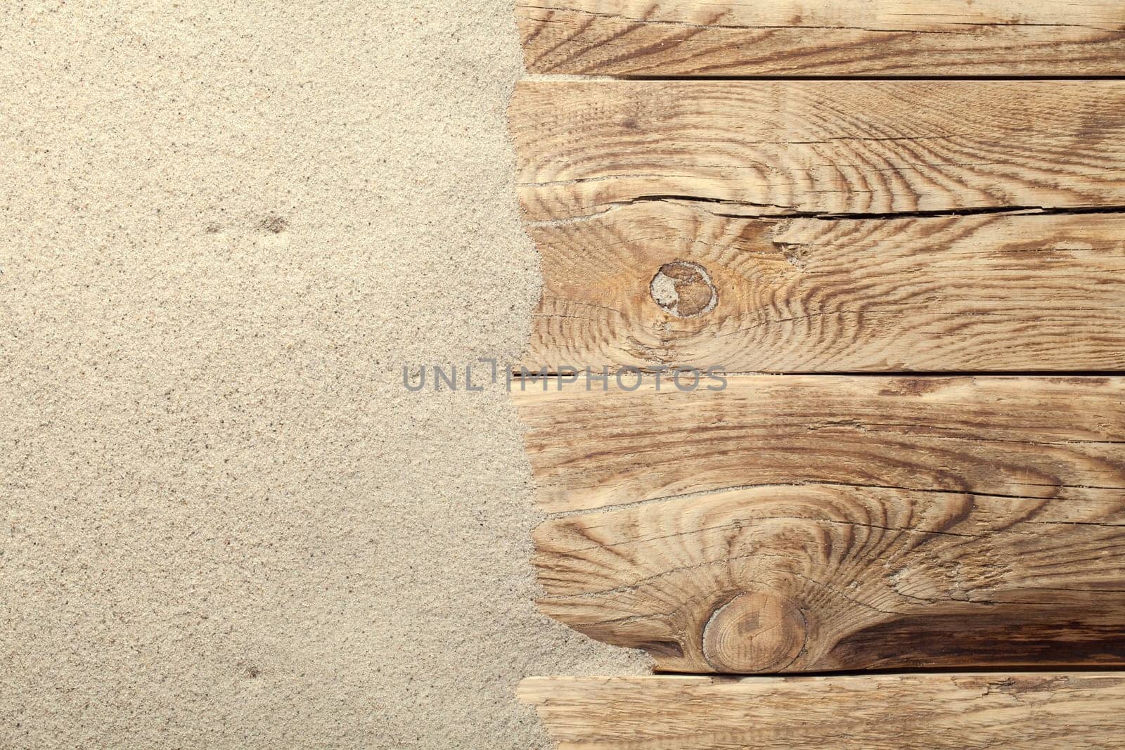 sand on the planked wood. summer background with copy space. top view