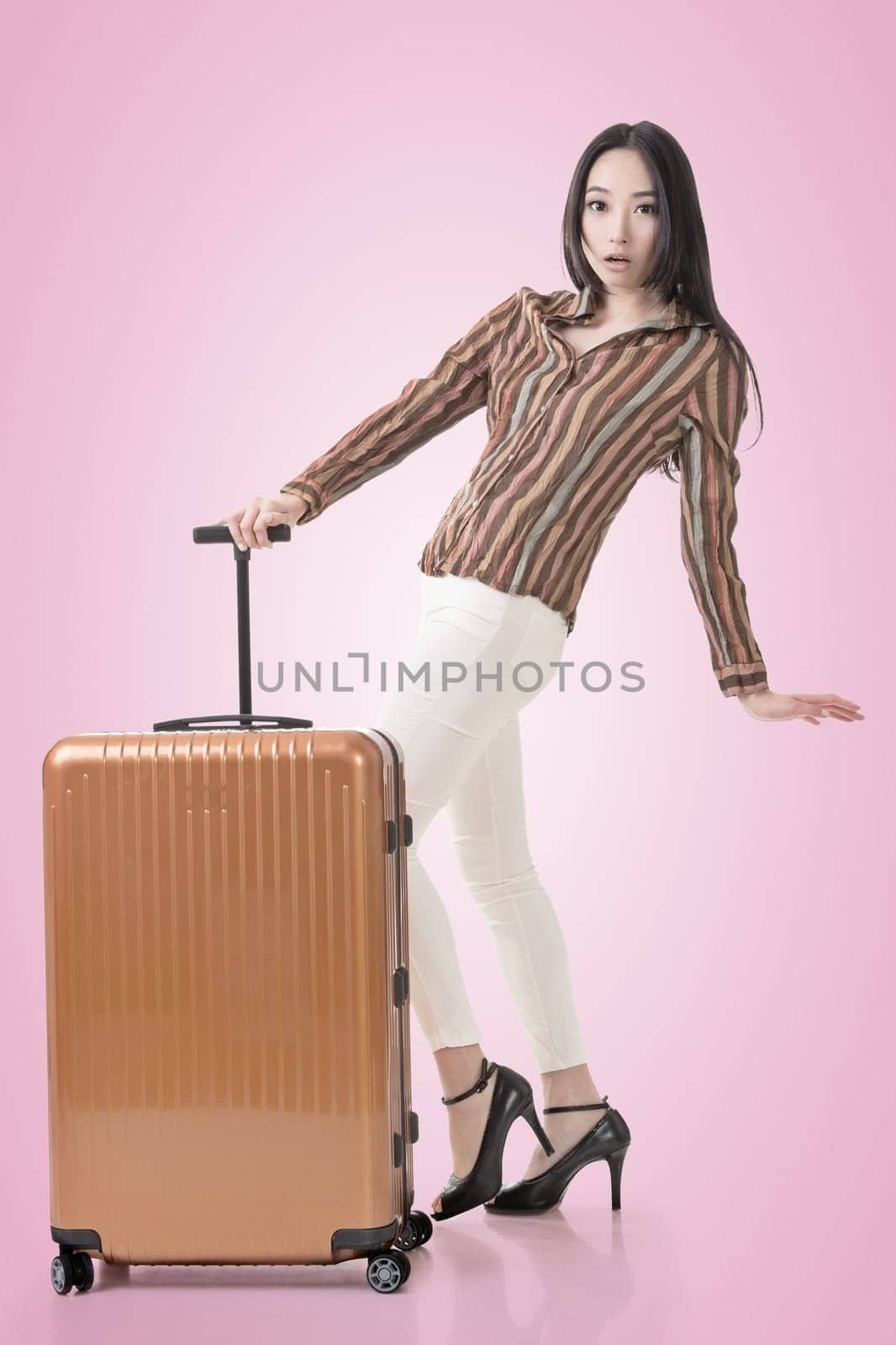 Modern Asian woman stand with a luggage.