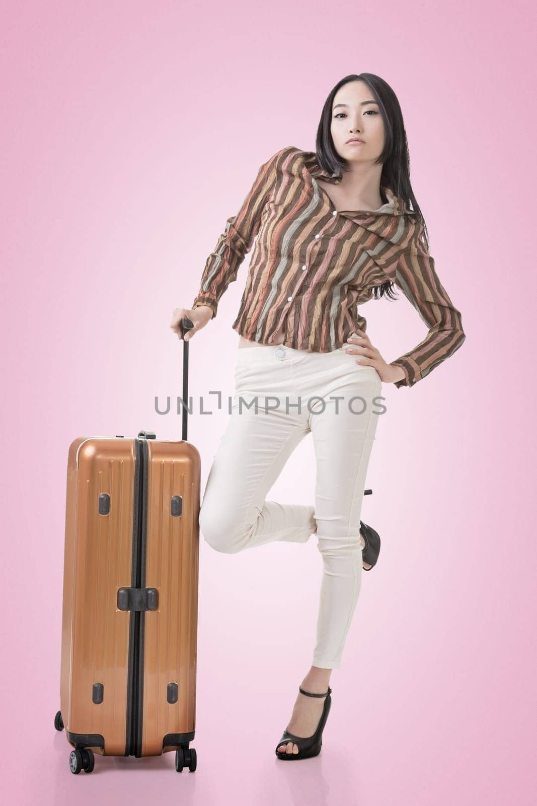 Modern Asian woman stand with a luggage in vintage style.