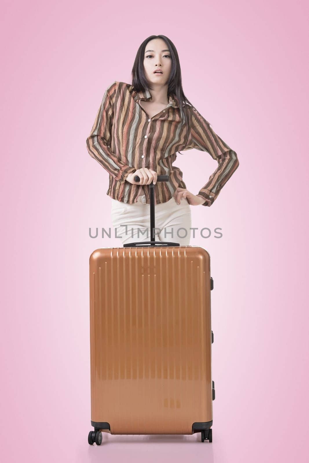 Modern Asian woman stand with a luggage.