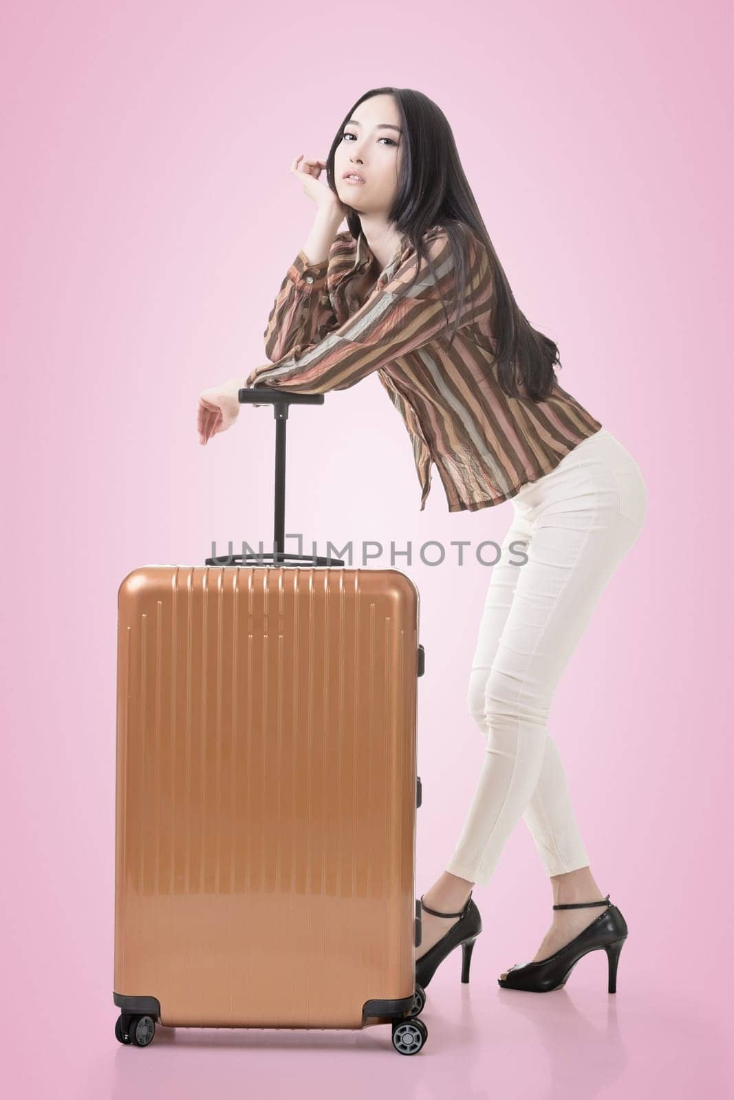 Modern Asian woman stand with a luggage.