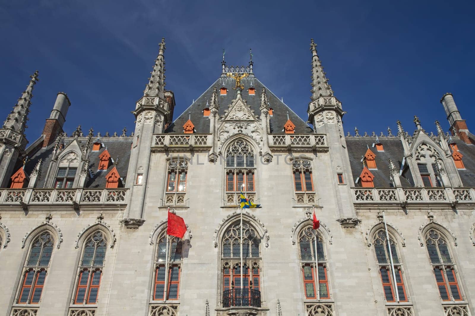 Front view of The Provinciaal Hof (Province Court) is a Neogothical building on the market place in Bruges (Belgium)