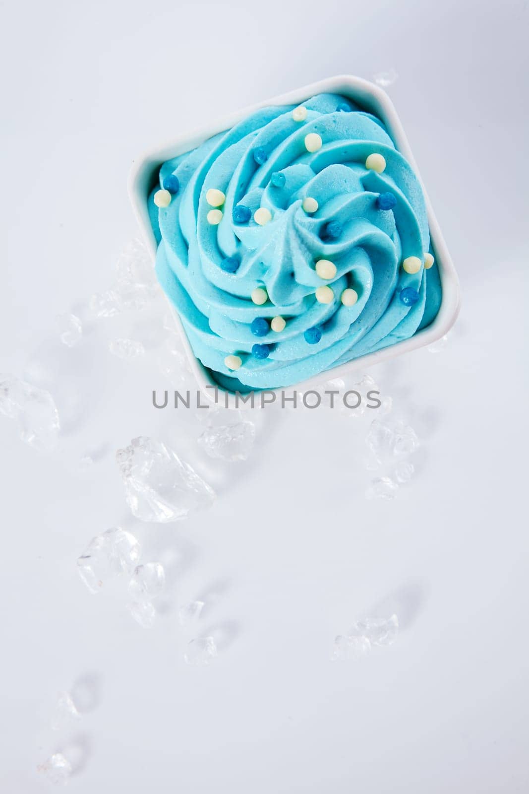 Healthy Colored Frozen Yogurt with Ices on Side. Isolated on White Background. Top Angle Capture.