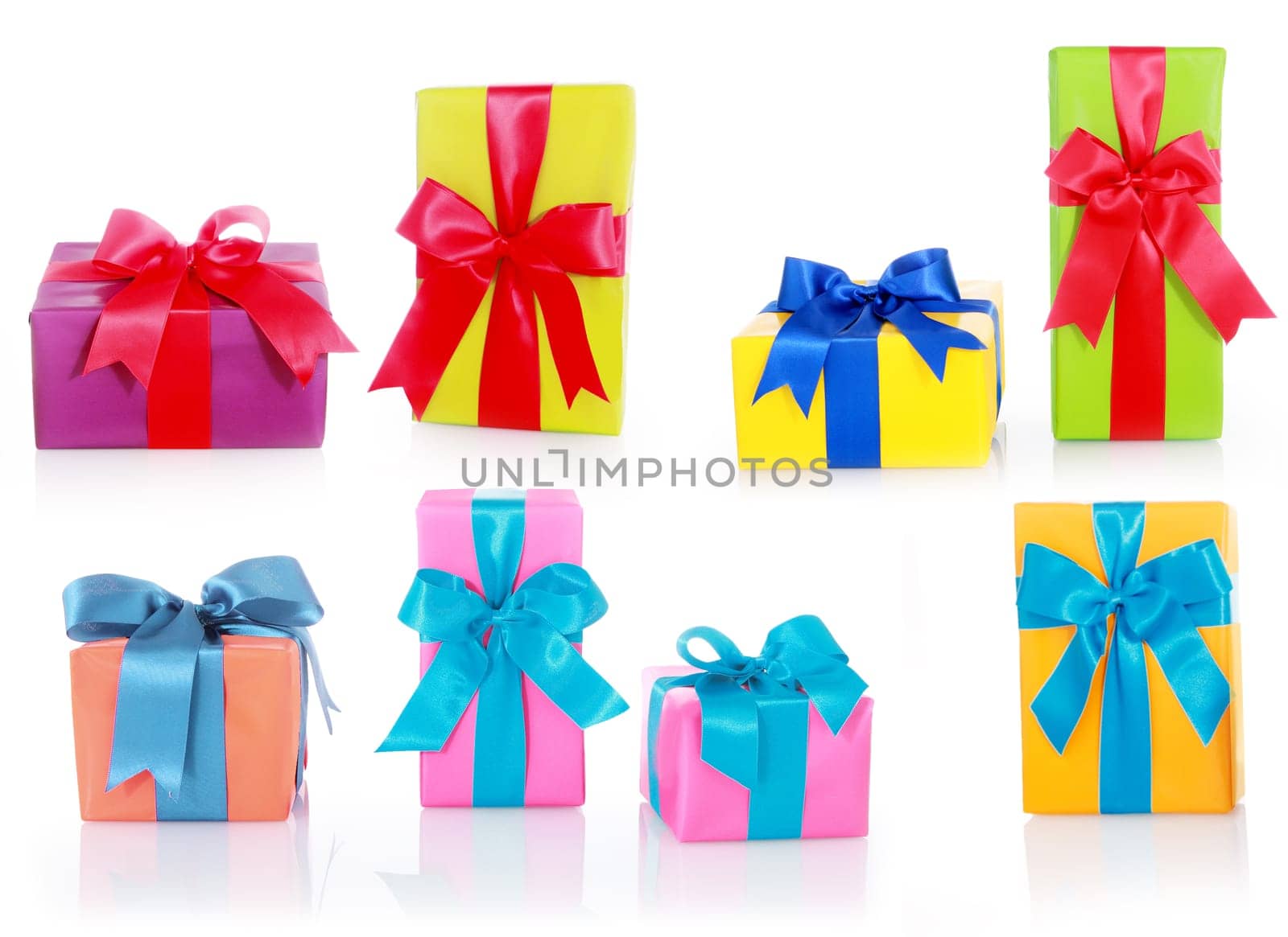 Assorted Sizes and Colors Gift Boxes with Big Ribbons Isolated on White Background.