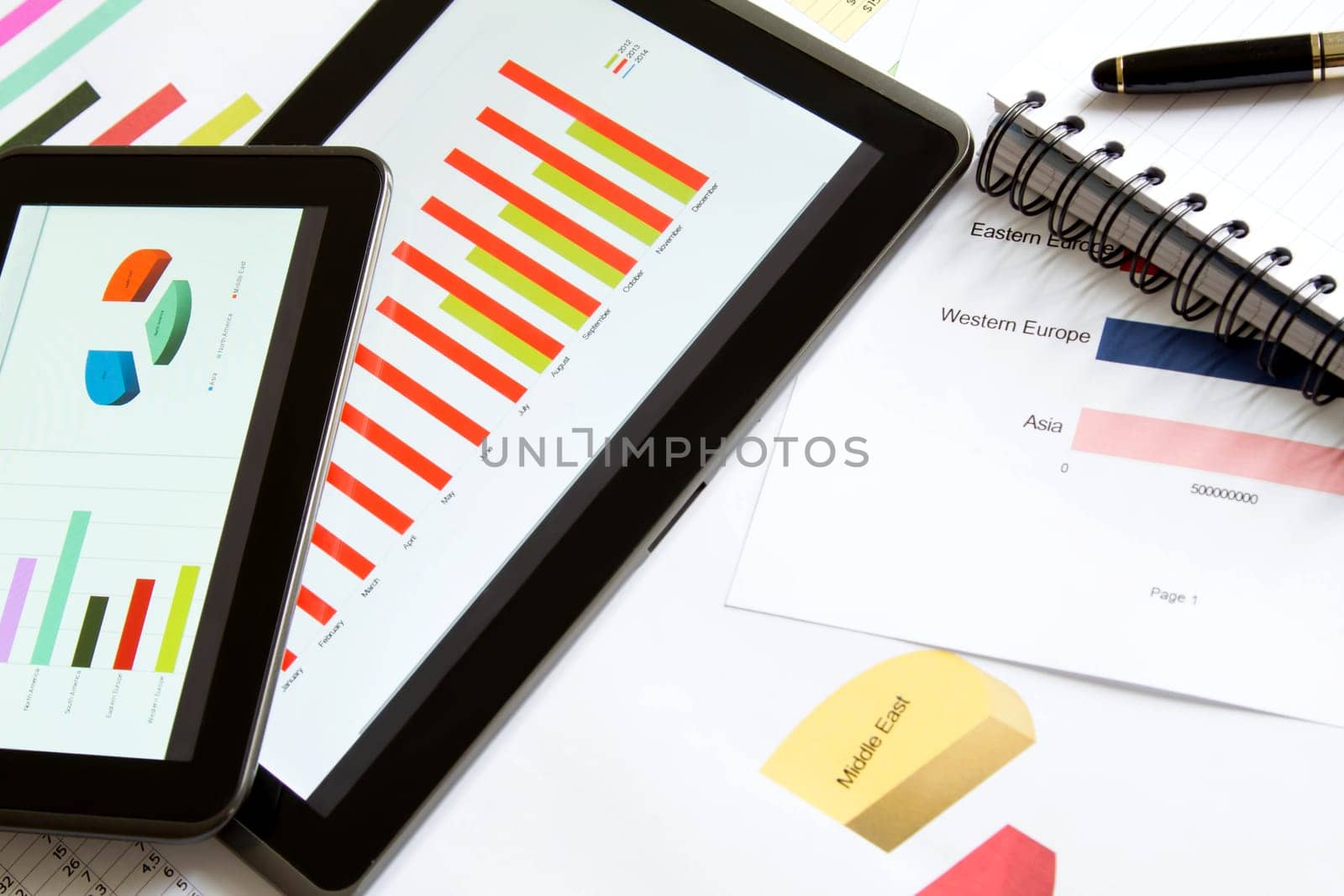 Working, analyzing graphics with the tablet and doing calculations.