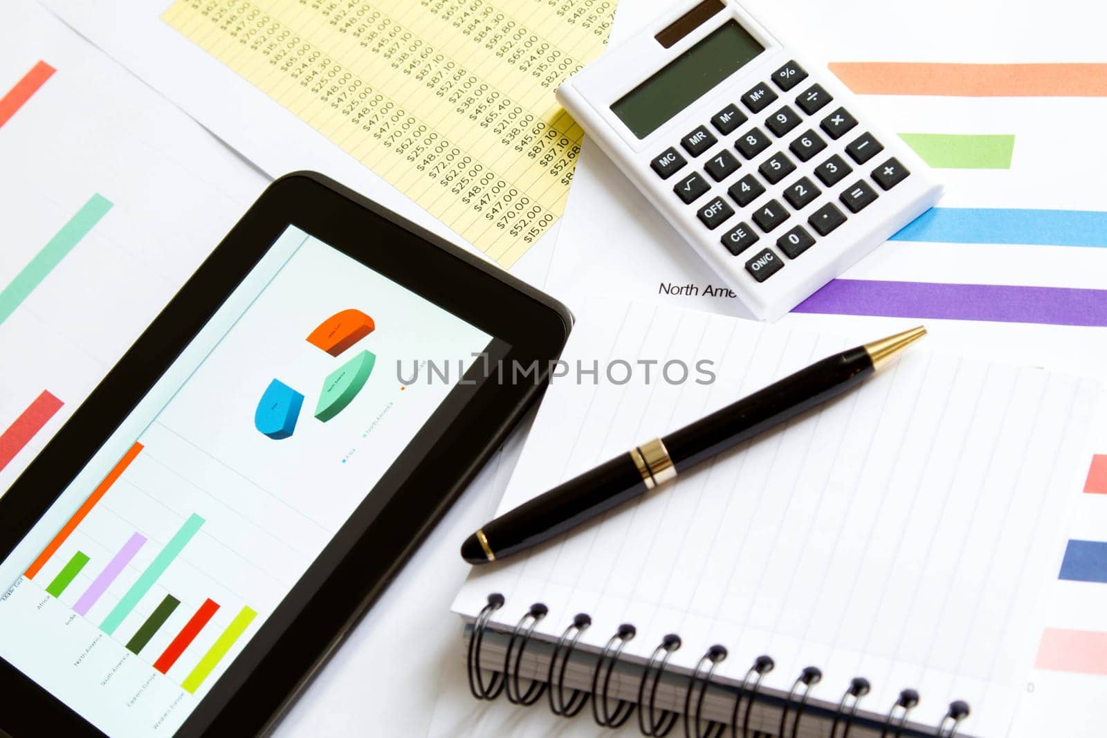 Working, analyzing graphics with the tablet and doing calculations.