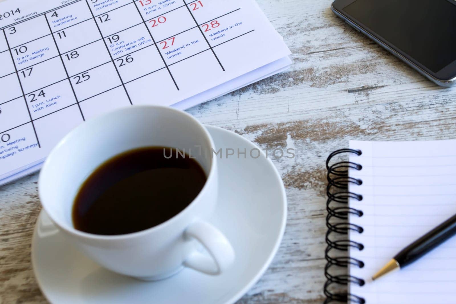 Checking monthly activities and appointments at the office.