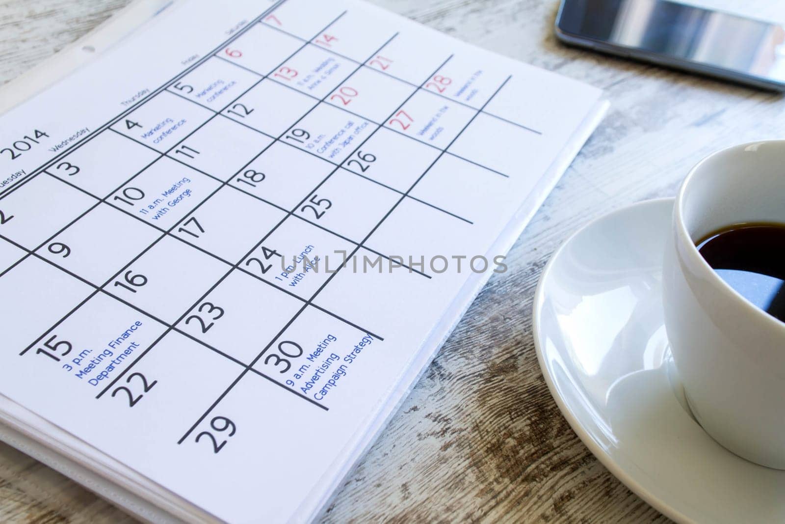 Checking monthly activities and appointments at the office.