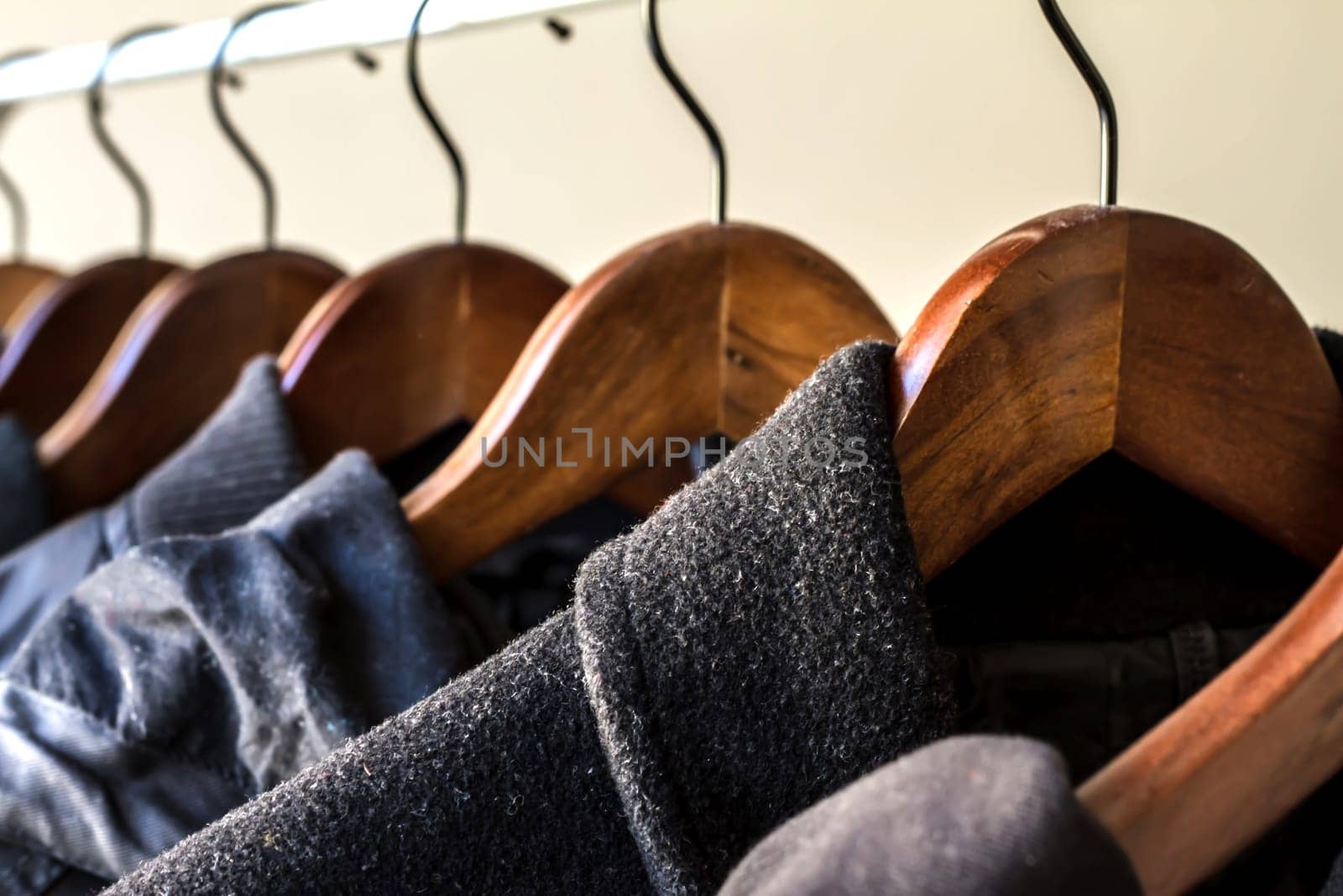 Winter clothes hanged on a clothes rack.