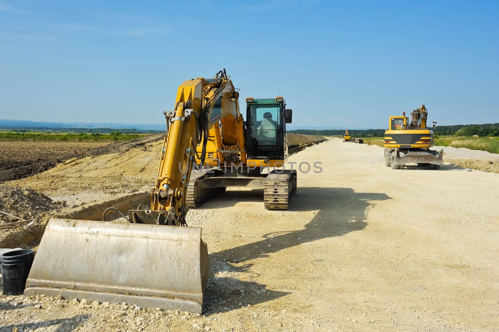 Excavators in road construction