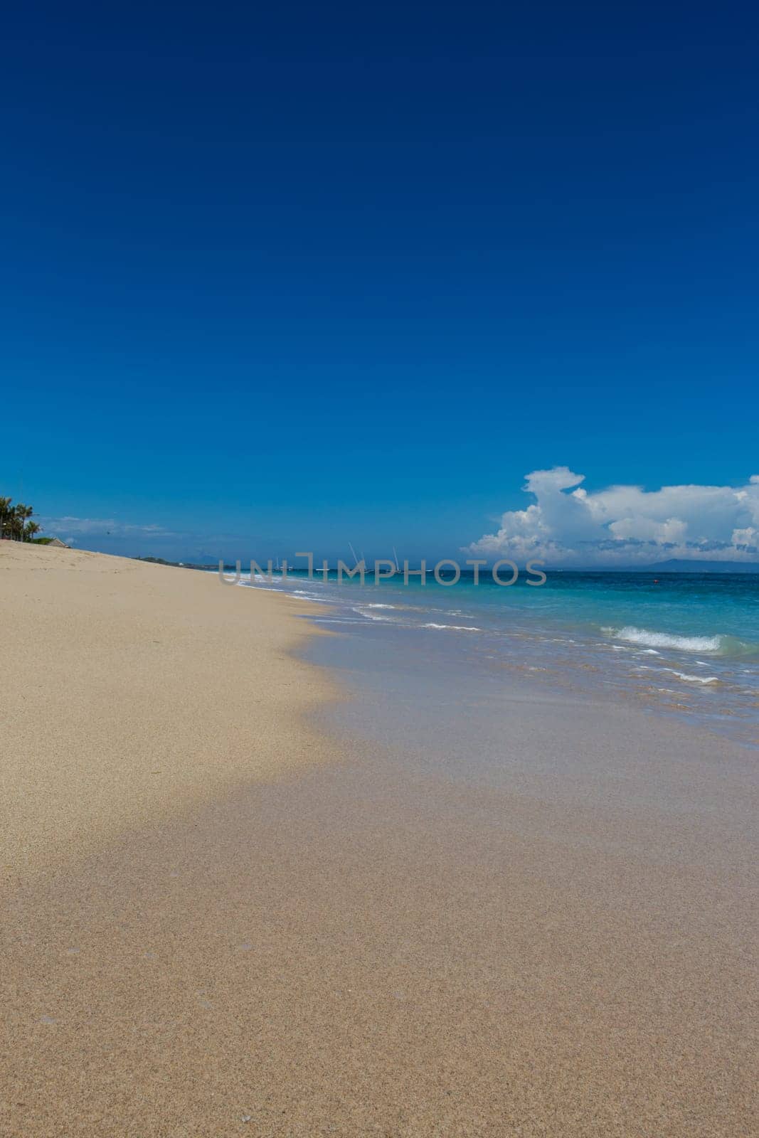 Beautiful secluded sandy beach in the Caribbean with white sand and blue sky as in paradise