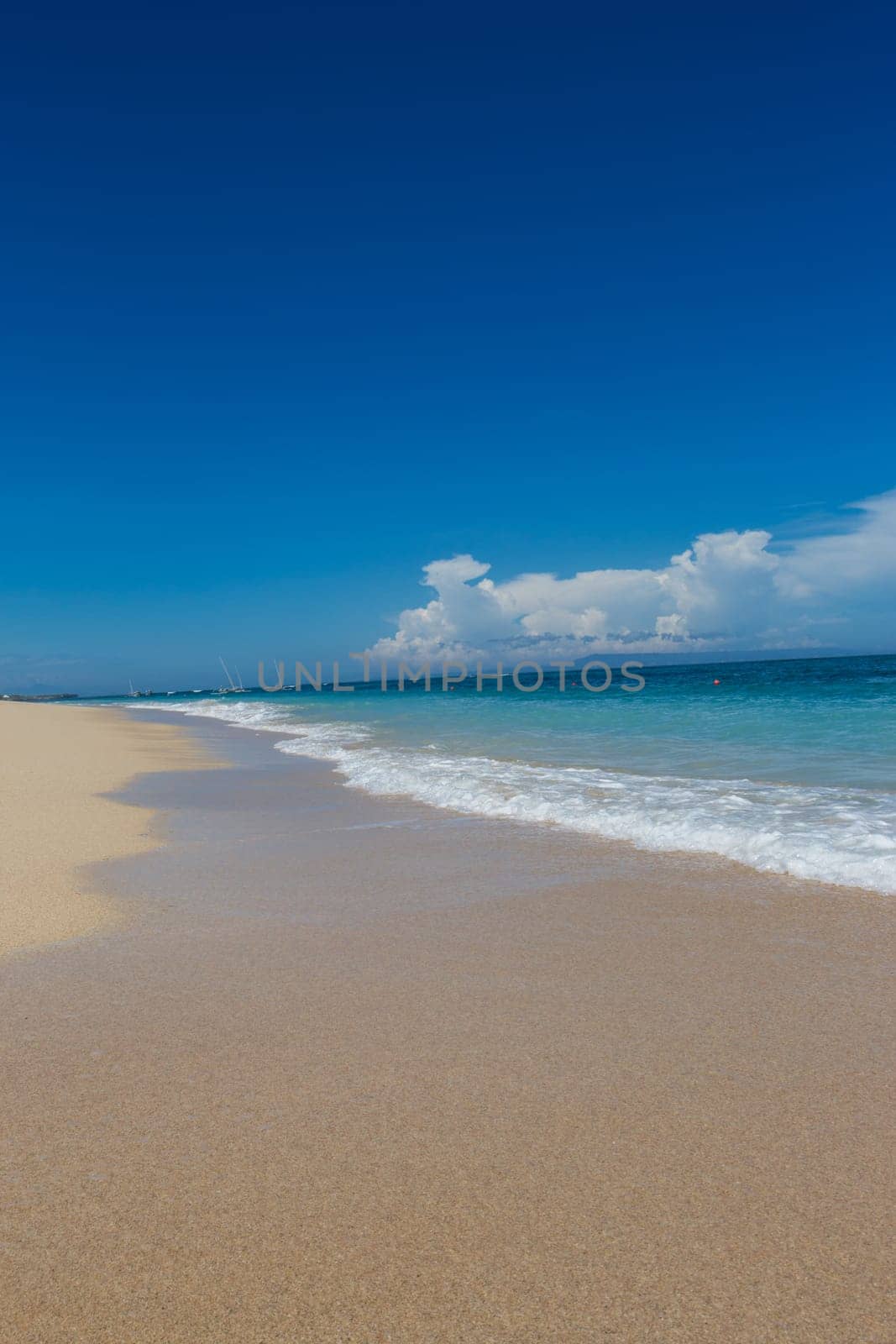 Beautiful secluded sandy beach in the Caribbean with white sand and blue sky as in paradise