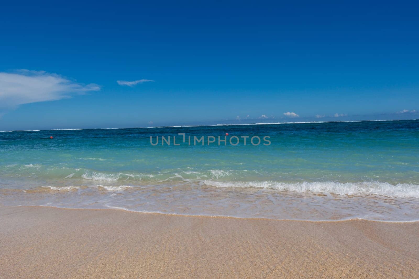 Beautiful secluded sandy beach in the Caribbean with white sand and blue sky as in paradise
