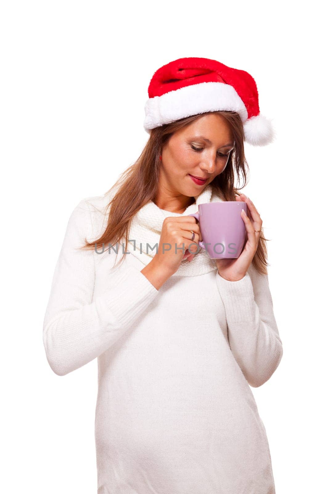 Attractive young woman with red Santa hat drinks a hot cup of coffee she weighs in her hands to warm her hands Insulated freeagent