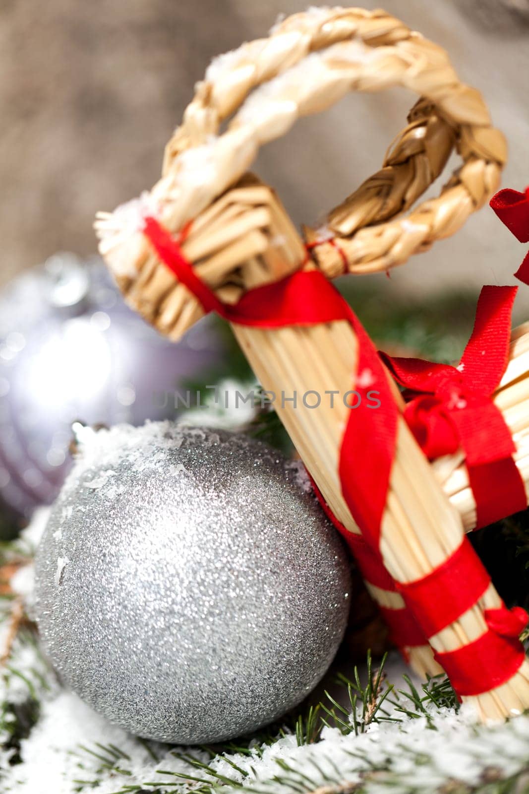 Silver Christmas bauble jewelry with deer and fir branches decoration for Christmas as macro detail