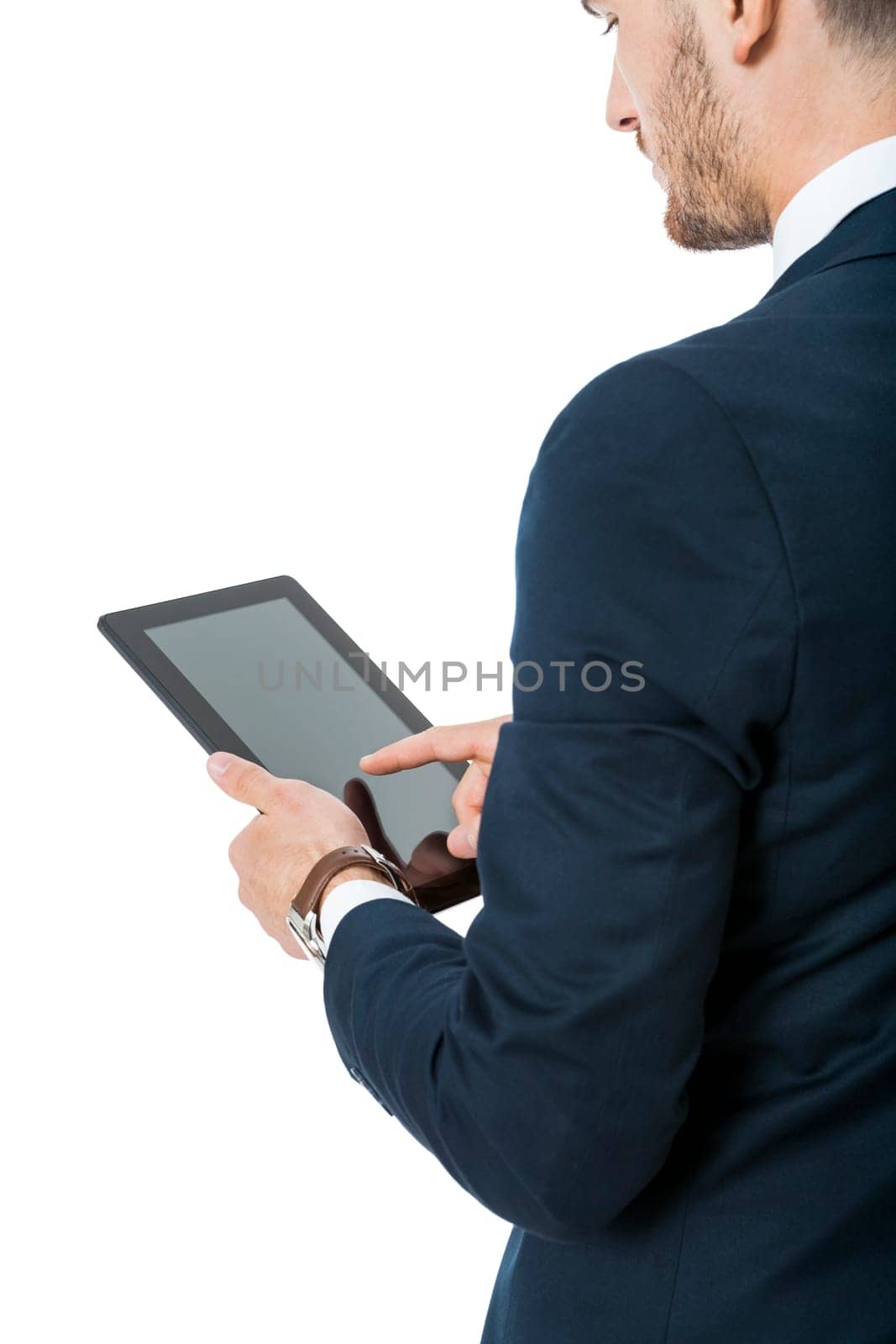 Businessman with a tablet computer touchscreen with his finger while surfing close-up from hands and tablet isolated on white background