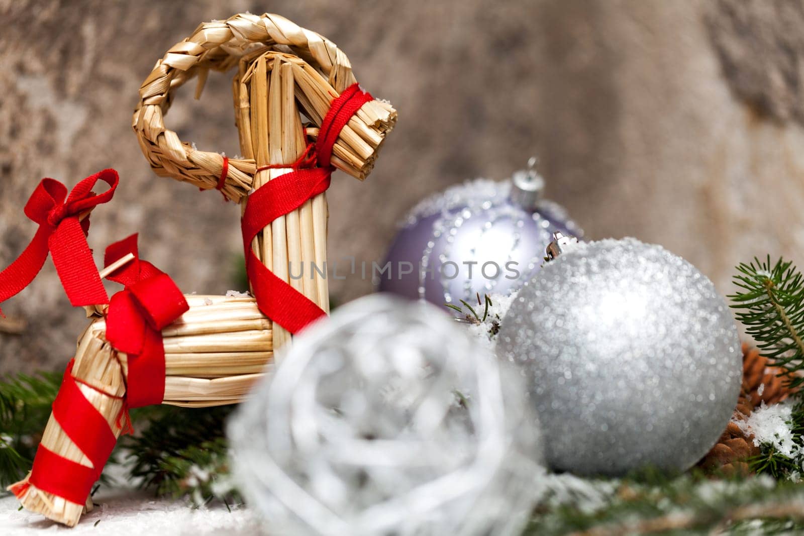 Silver Christmas bauble jewelry with deer and fir branches decoration for Christmas as macro detail