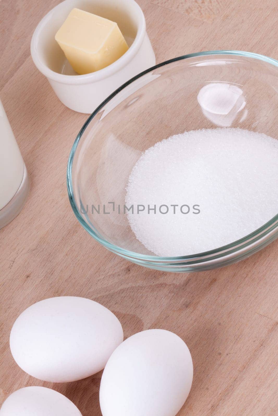 Baking ingredients in the kitchen me eggs,flour,butter and sugar to stir a dough and bake a cake
