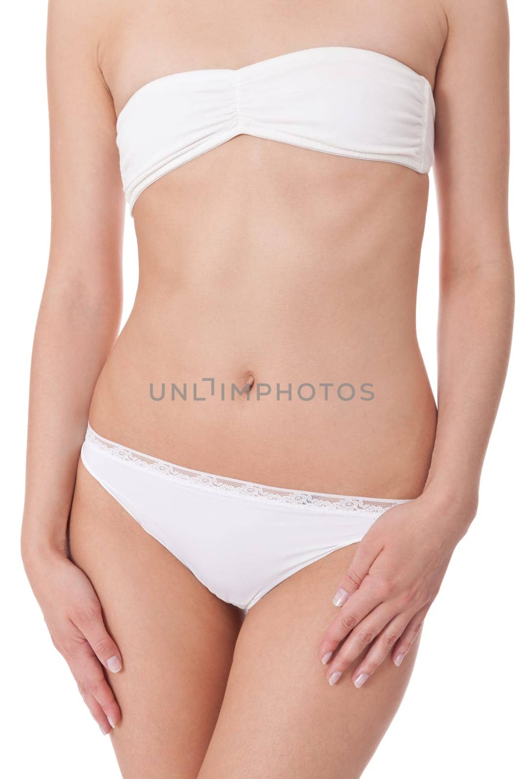 attractive sexy woman's body in white underwear with briefs and bra insulated against white background