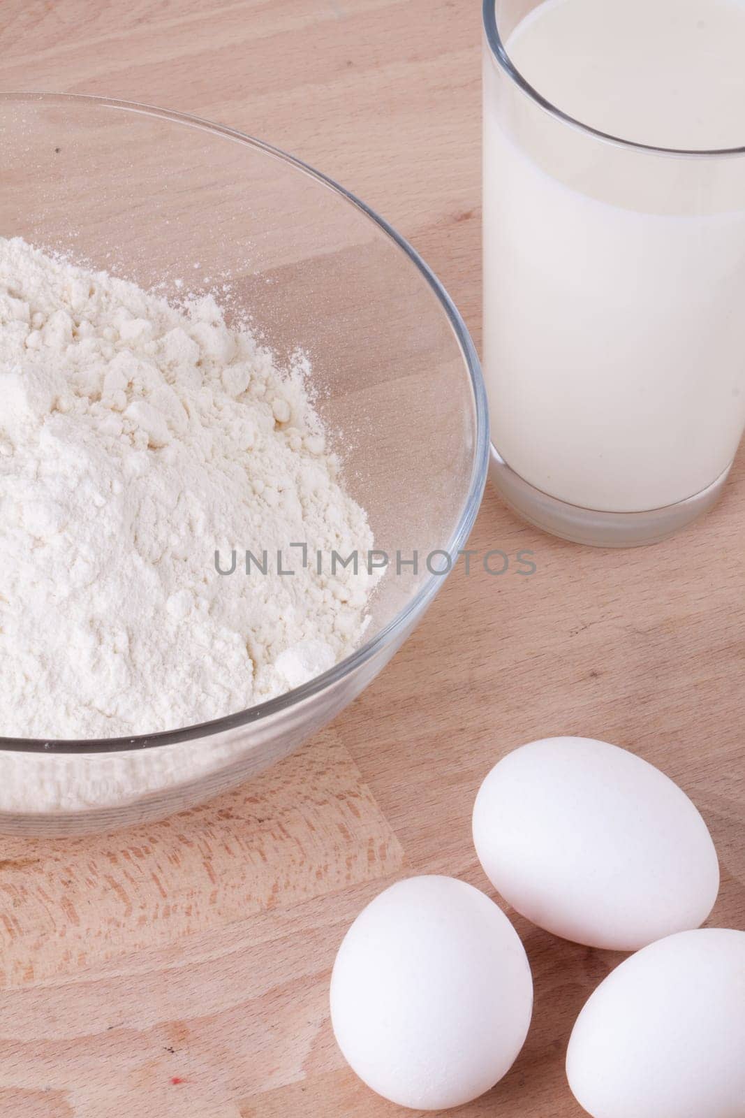 Baking ingredients in the kitchen me eggs,flour,butter and sugar to stir a dough and bake a cake