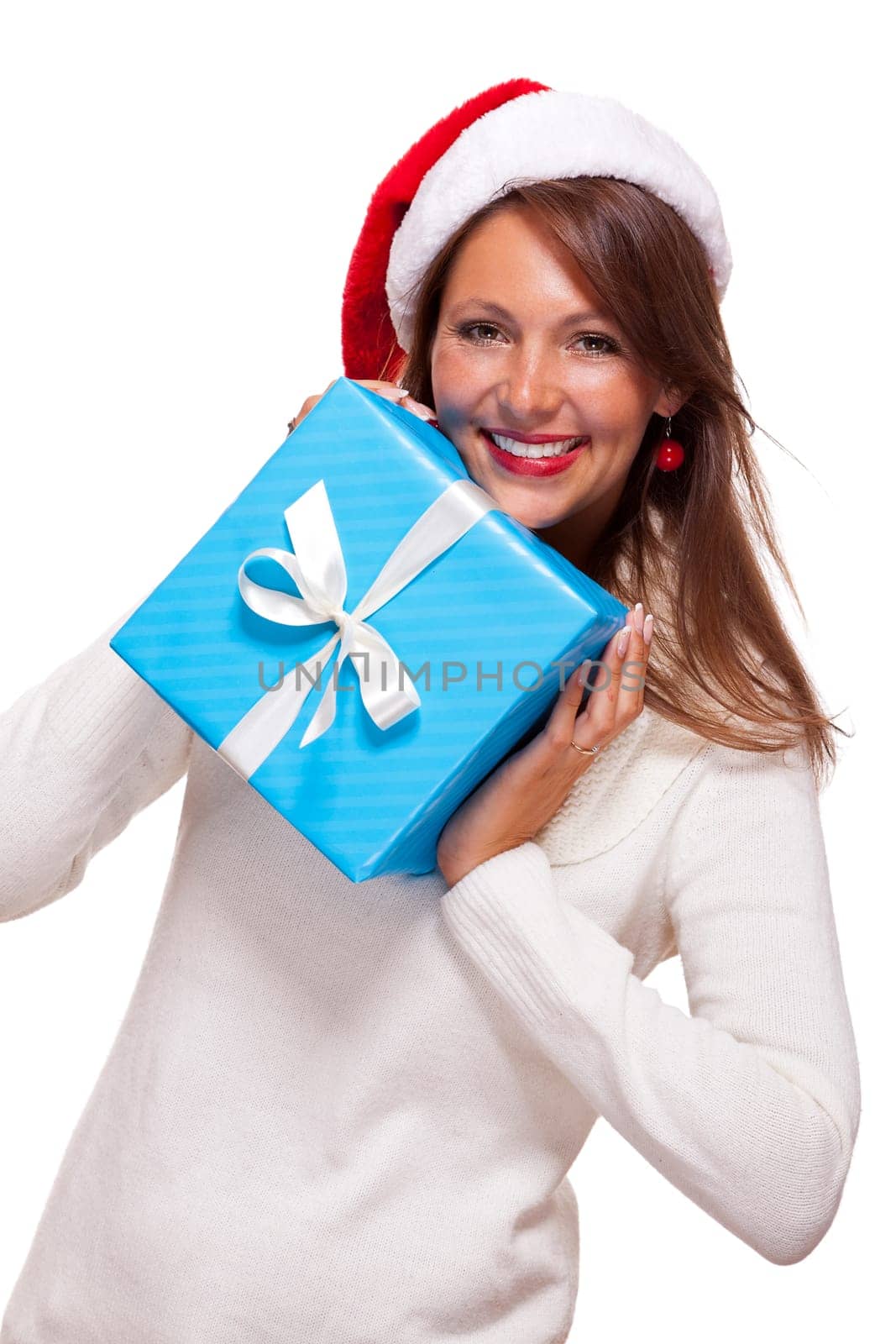 Young woman with brown hair and Christmas hat with a large turquoise colored gift isolated against white background