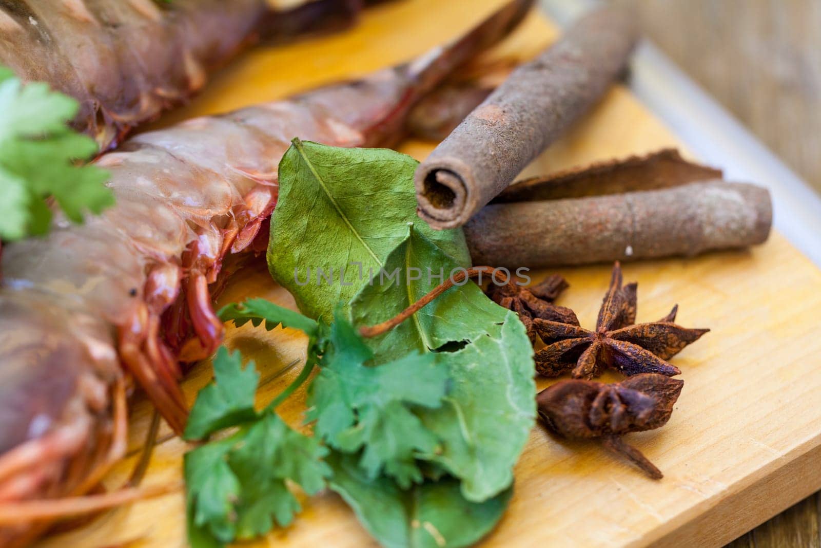 Ingredients for Tom Yam soup with lemongrass shrimp coriander on a kitchen board