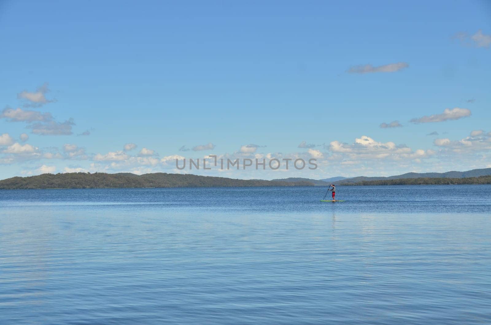 lone paddler on padelboard
