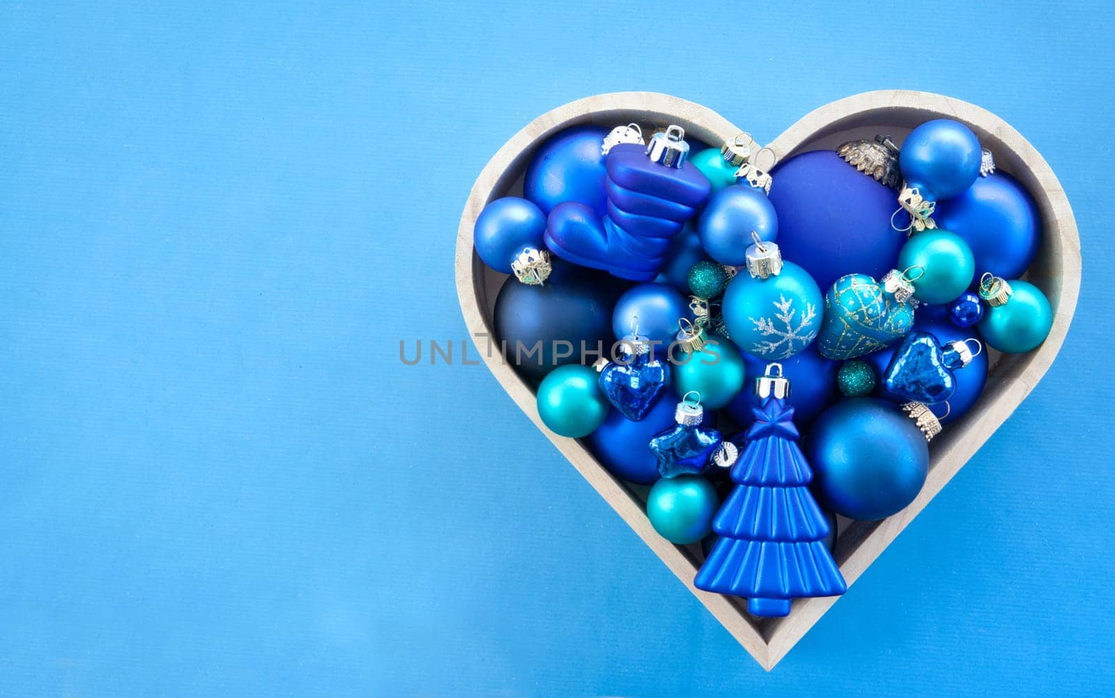 Various blue Christmas tree balls in heart shape