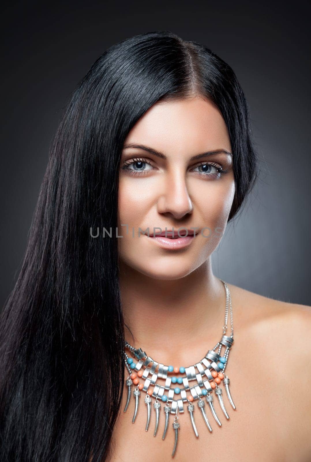 Young beauty with perfect skin and long dark hair