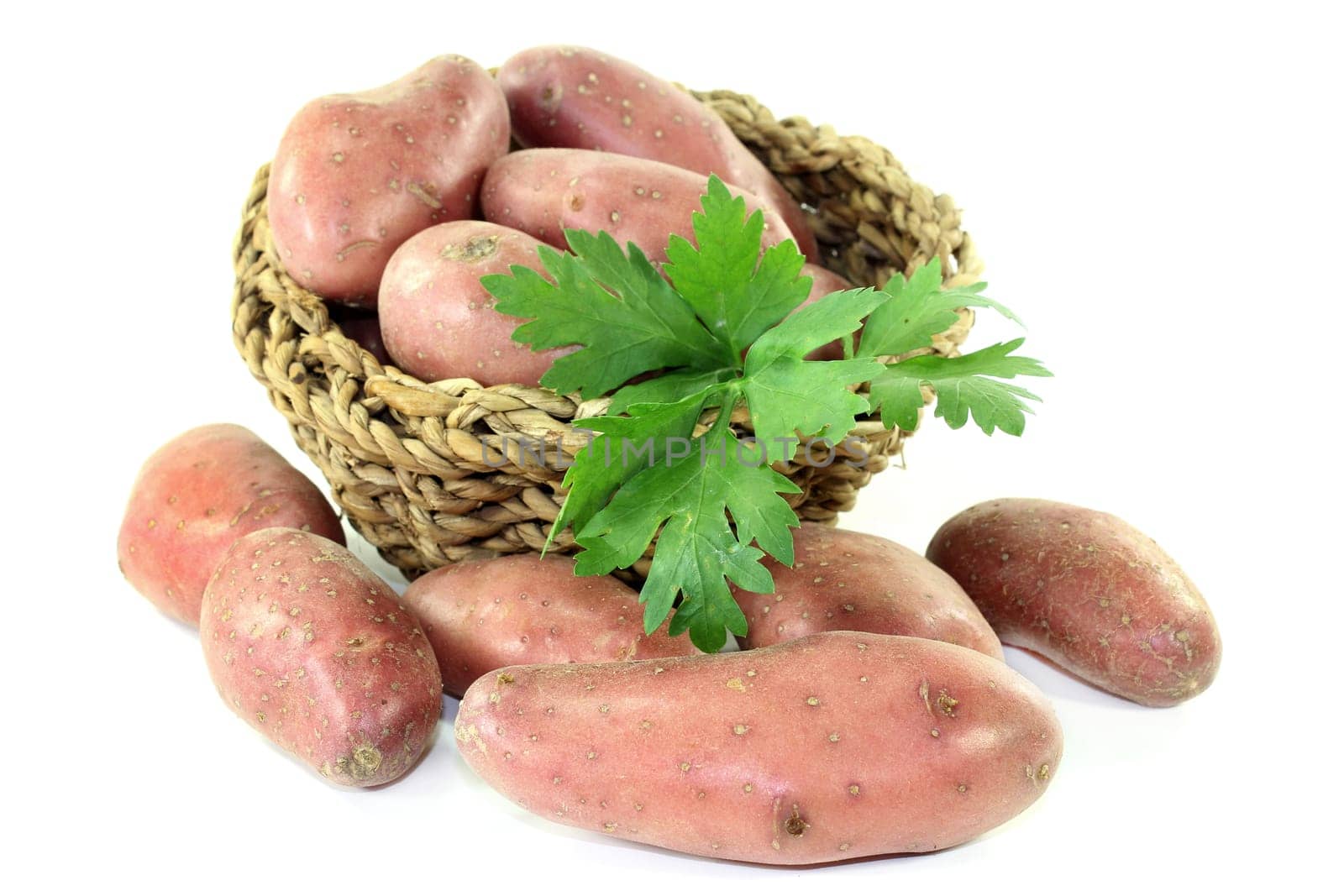 raw,red potatoes against a white background