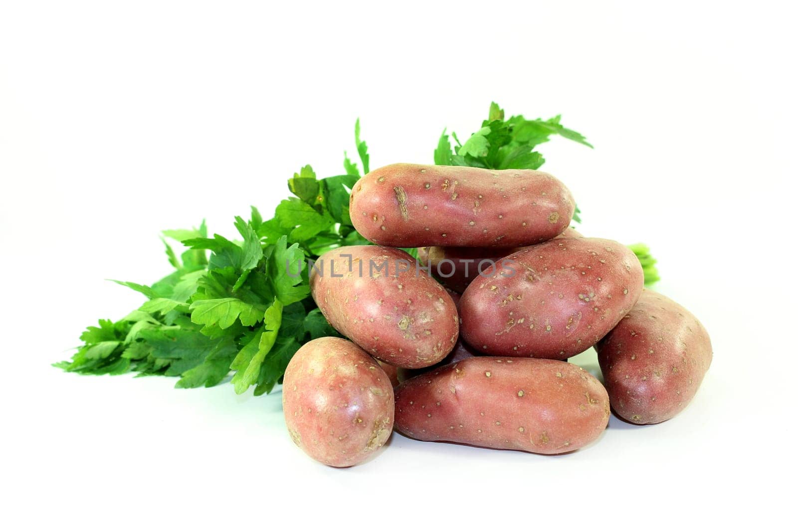 raw,red potatoes against a white background