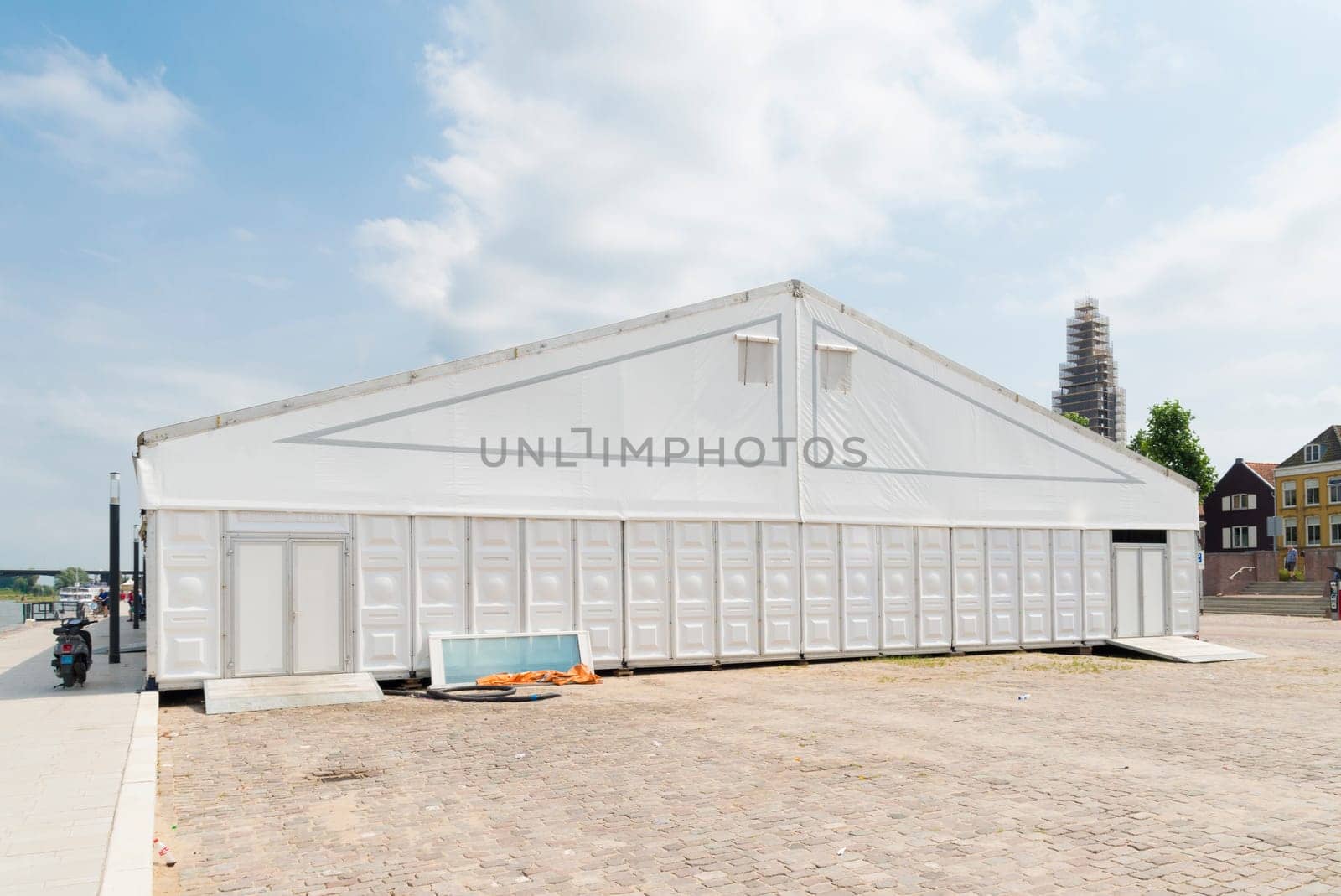 large white event tent under a sunny sky