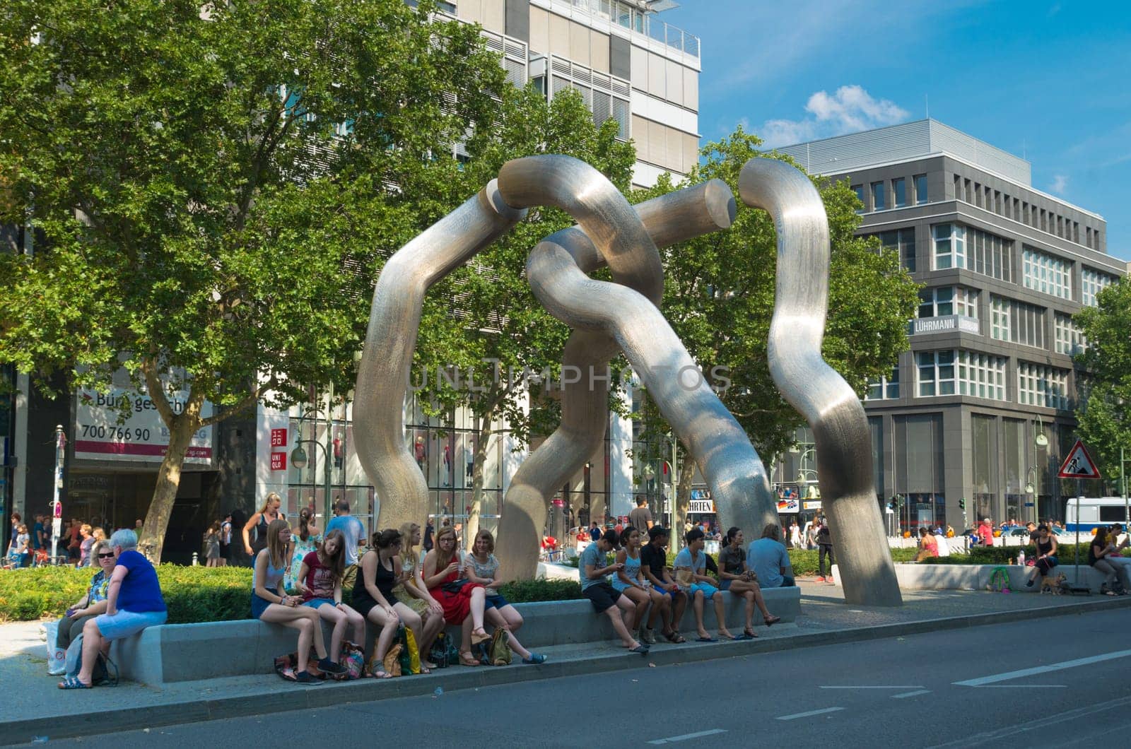 people around a modern sculpture in berlin, germany. The monument was installed in 1987 by Brigitte Matschinsky-Denning hoff and Martin Matschinsky