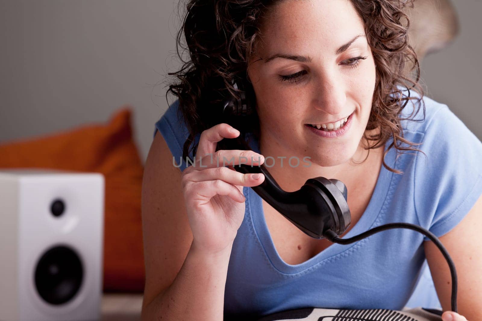 young woman chatting and doing gossip in her room