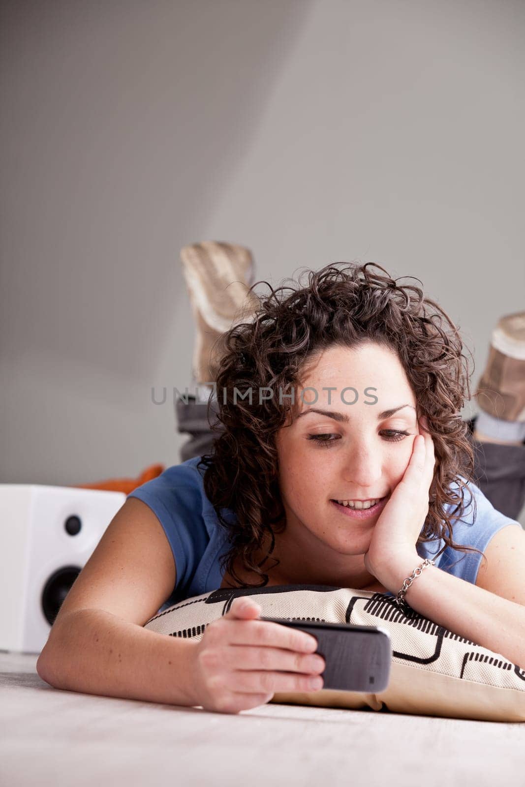 this girl watches his boyfriend on her mobile phone