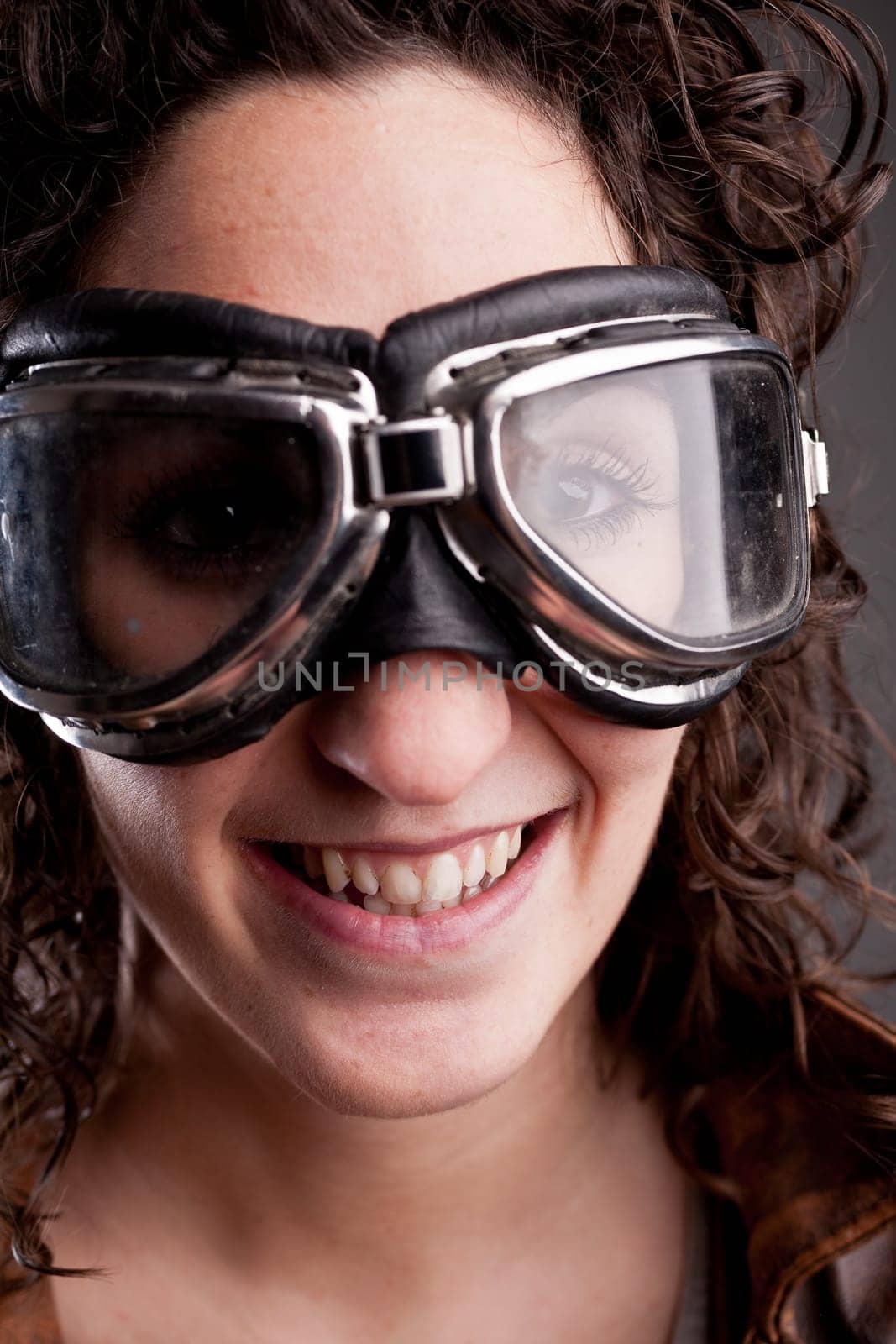 this girl has big motorcycle glasses and is seriously determined