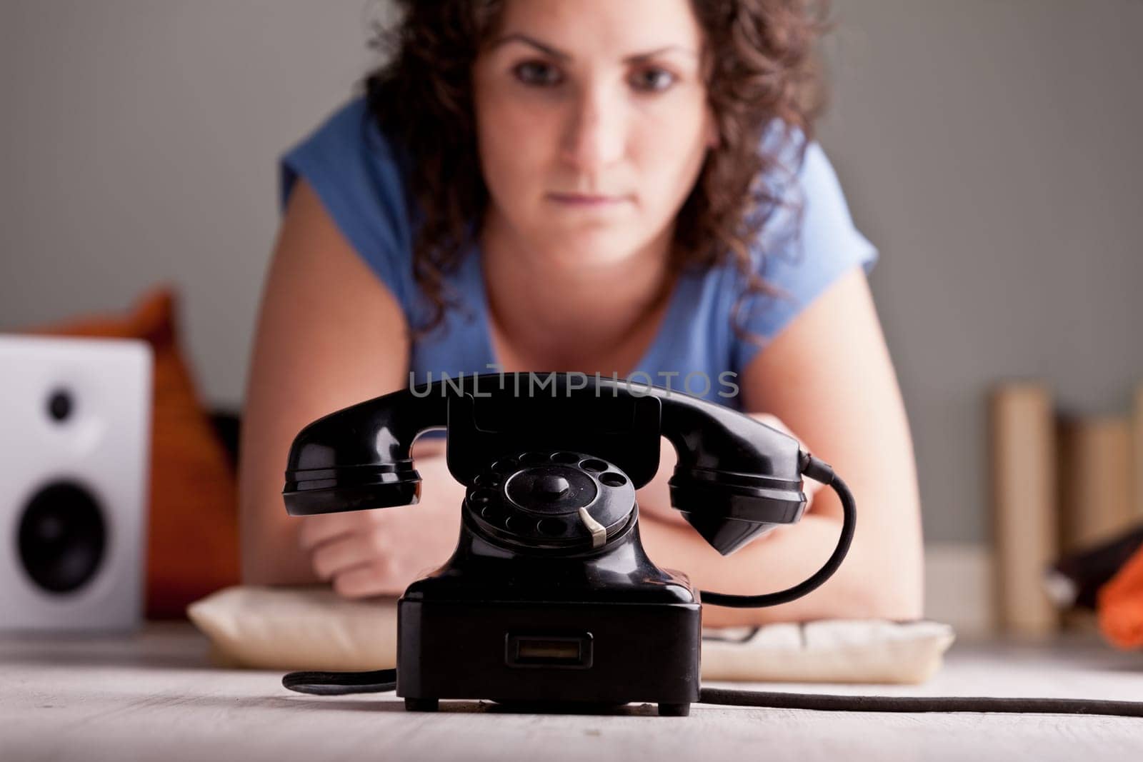 Girl waiting for a telephone call