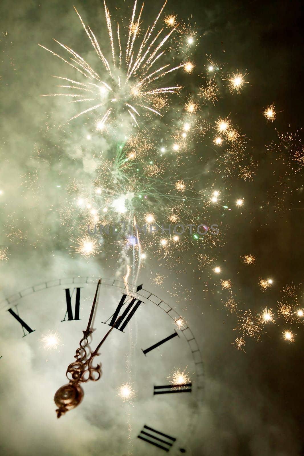 New Year's at midnight - Old clock with stars snowflakes and holiday lights