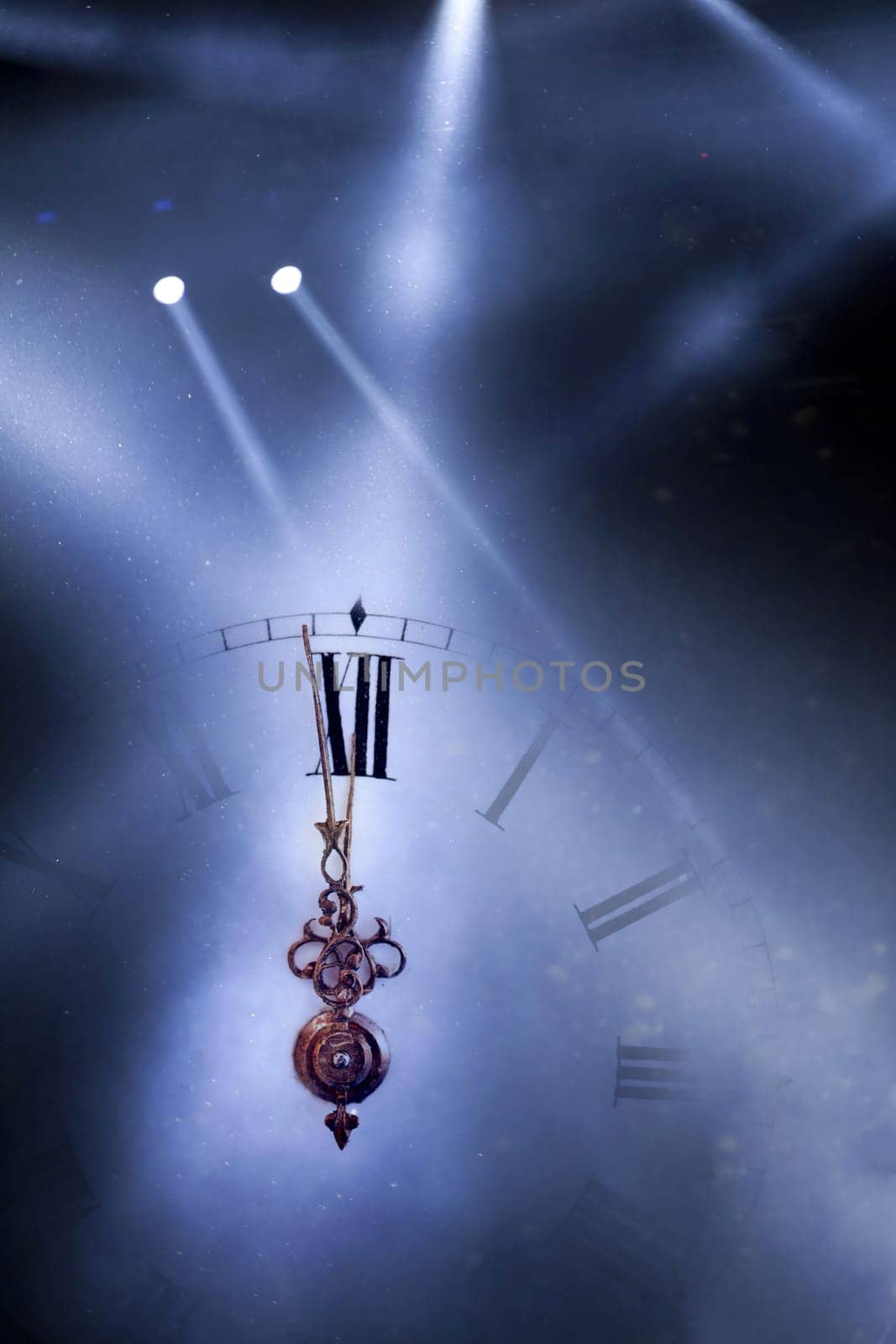 New Year's at midnight - Old clock with stars snowflakes and holiday lights