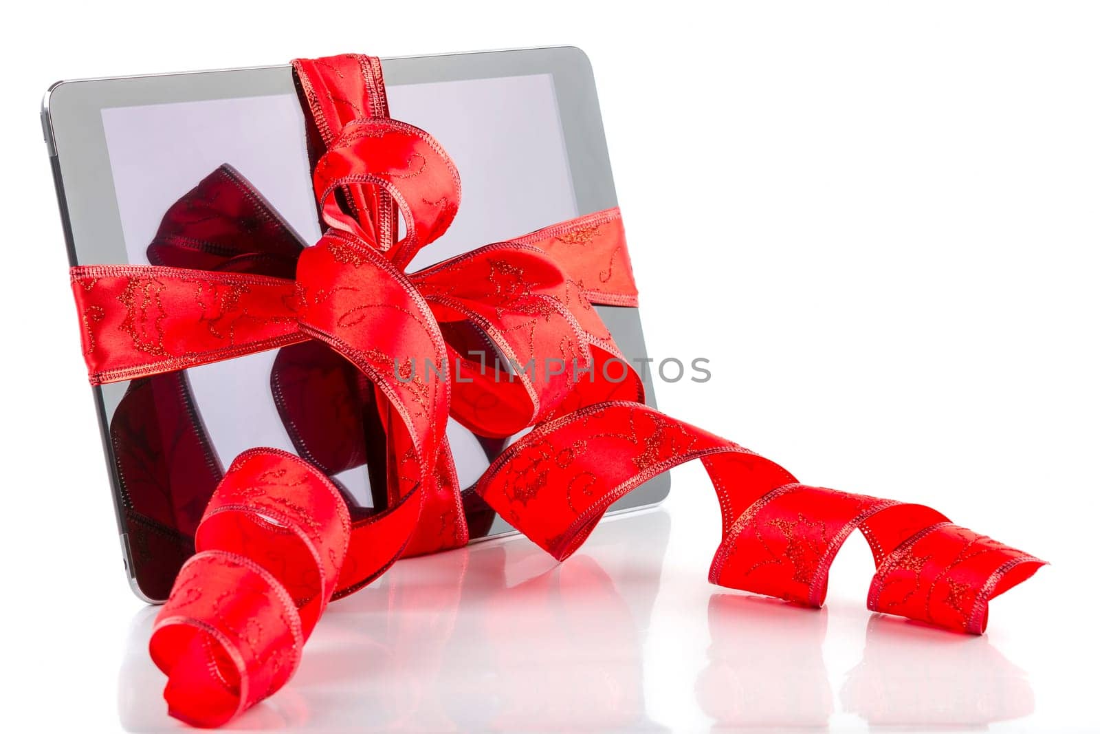 tablet pc with christmas decorations on white background