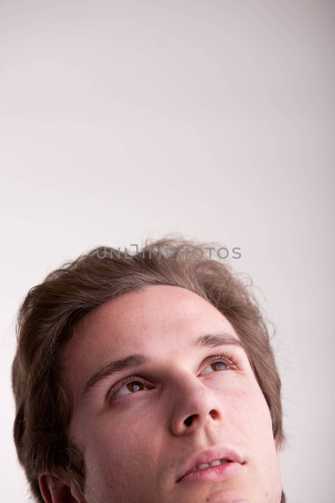 young man thinking about the future or a great idea