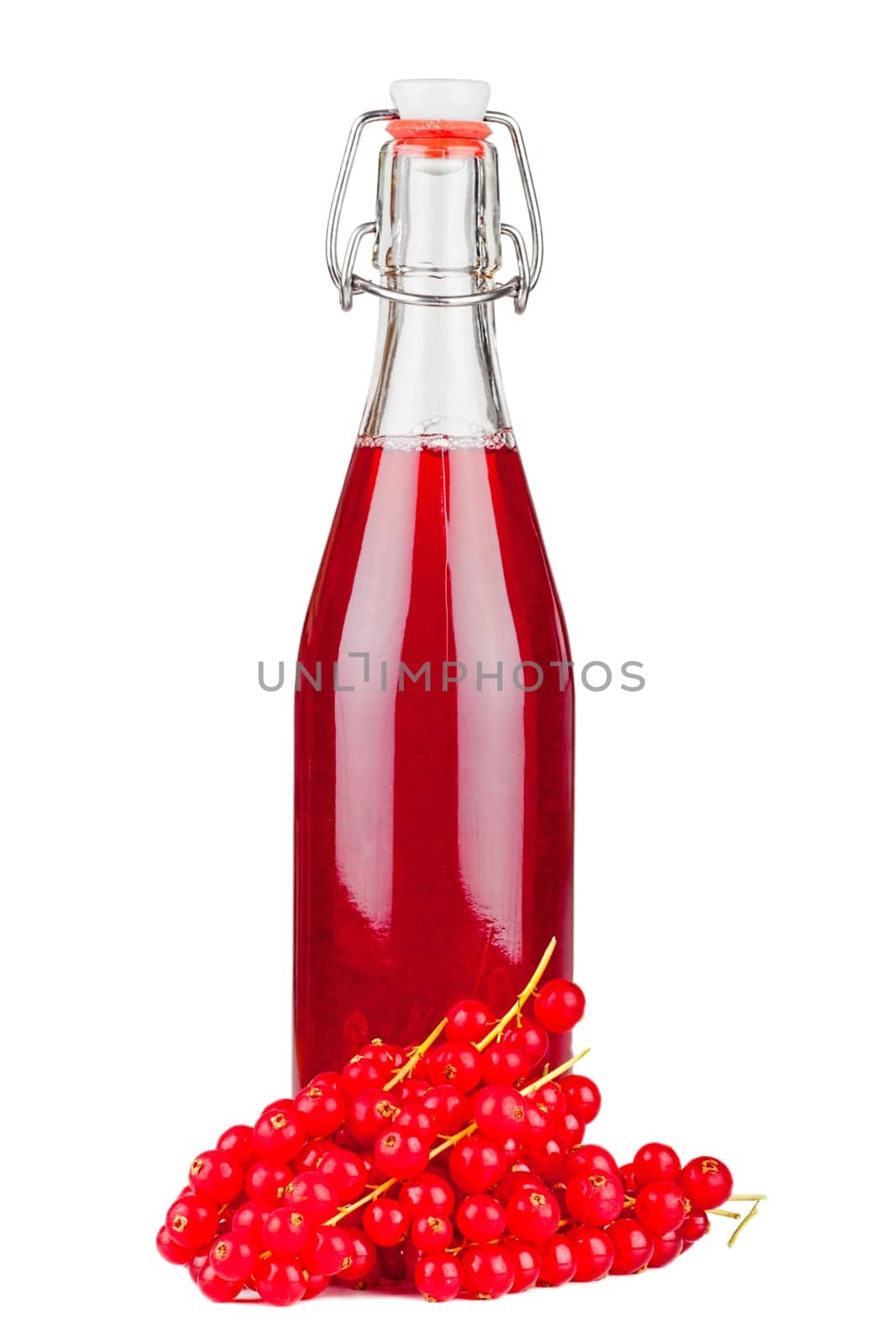 Fresh ripe and tasty currants and a bottle syrup isolated on white background