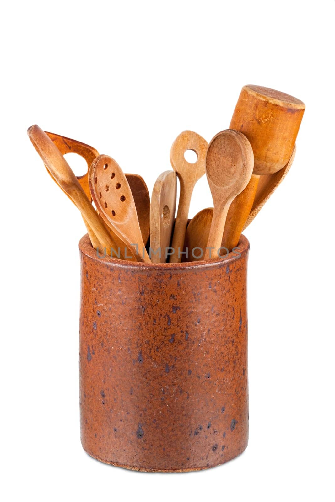 Old clay pot with wooden kitchen utensils isolated on white Background