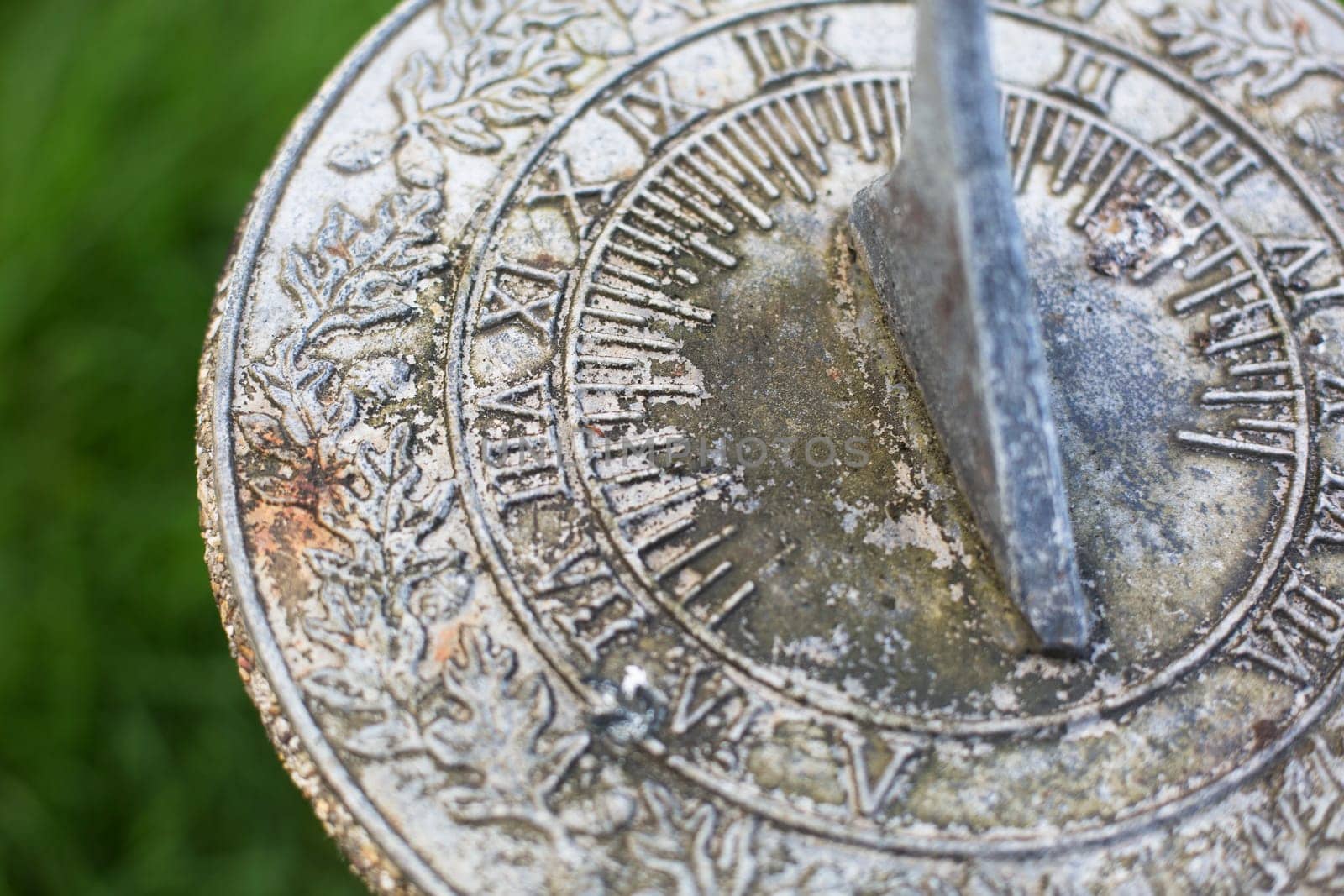 Close up of weathered  sundial in garden
