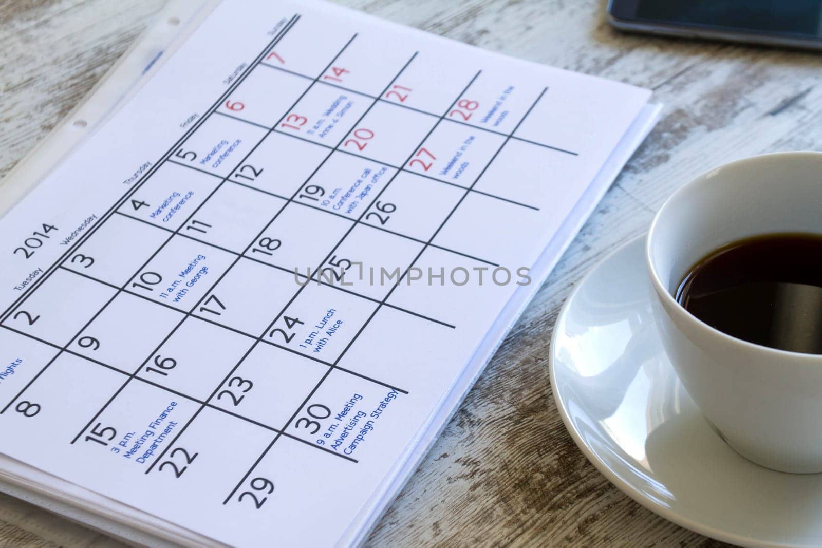 Checking monthly activities and appointments at the office.