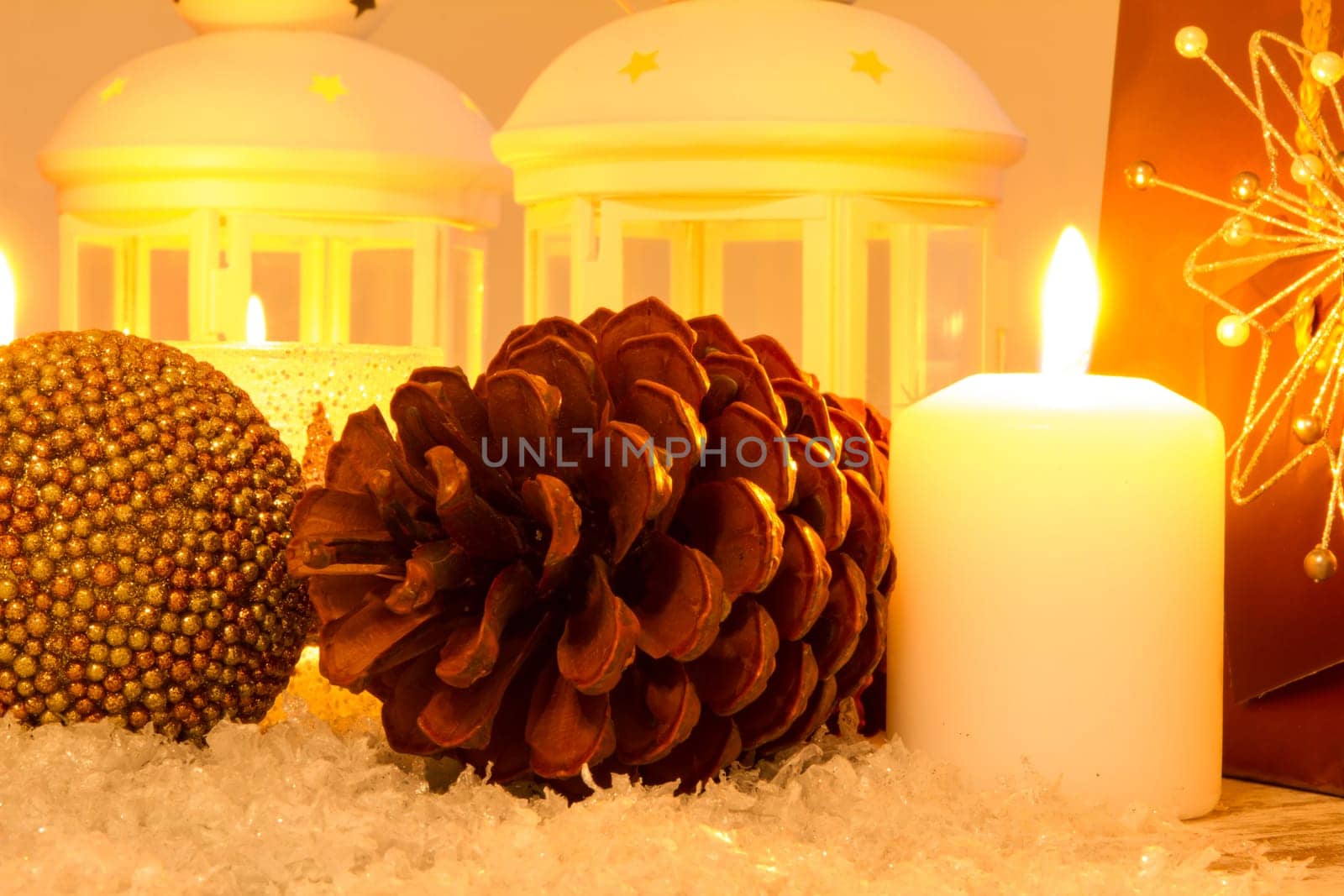 Christmas setting with candles, pine cones, shopping bags and baubles..