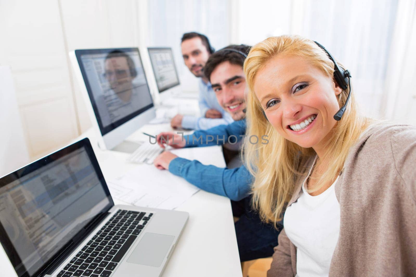 View of a Woman doing selfie with her colleagues